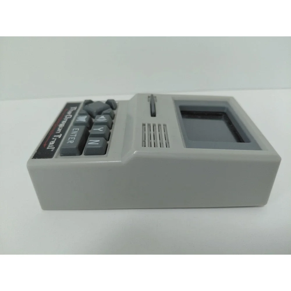 The Oregon Trail‎ Handheld Electronic Game Basic Fun 09597 Retro Travel Toy Grey